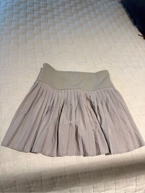 Fabletics Pleated Skater Skirt in Light Taupe and Stone